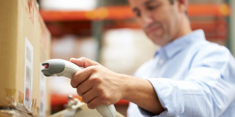 Worker Scanning Packages In fulfilment center